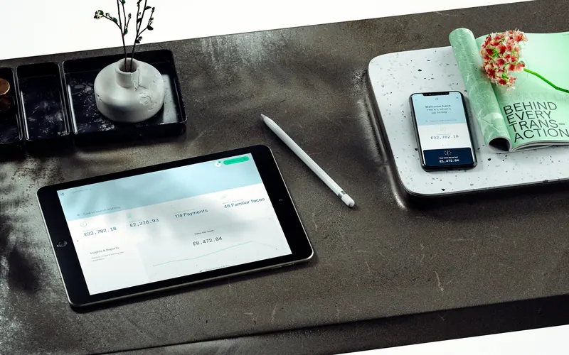 Pollinate merchant dashboard on an iPad, with the app on a phone beside it